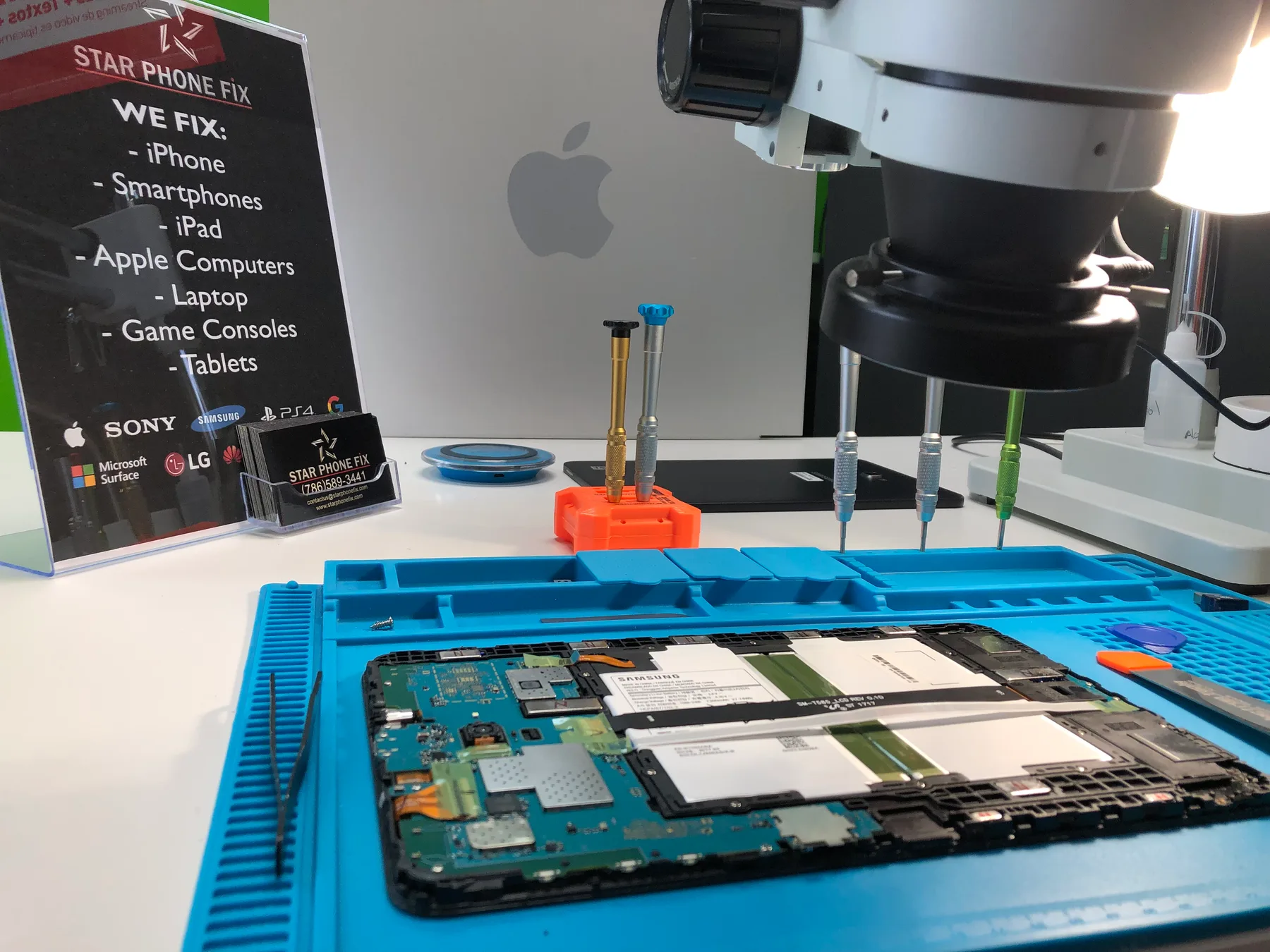 Android tablet repair workspace at Star Phone Fix in Hialeah