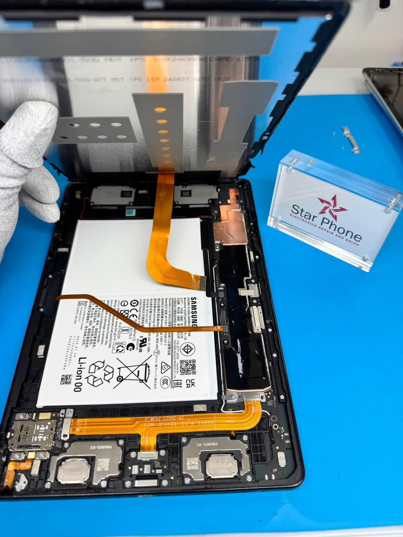 Android tablet repair workspace at Star Phone Fix in Hialeah